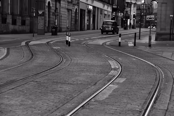 Black and white image of the tram tracks going uphill in Sheffield city